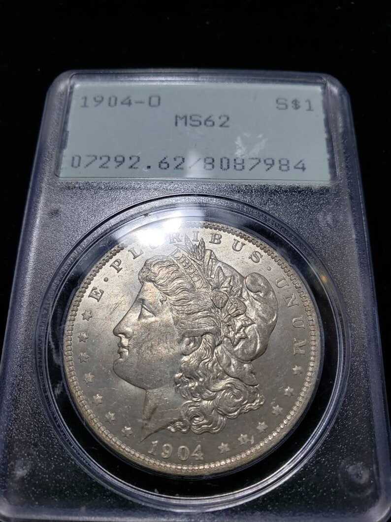 1904 O  Morgan Silver Dollar PCGS MS62, Old Green Rattler.   Lot # 1490 Regular 115