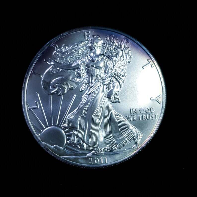 2011   American Silver Eagle BU  -  1 Oz .999 Cool toning on the rim-     Lot# 1210   Key date