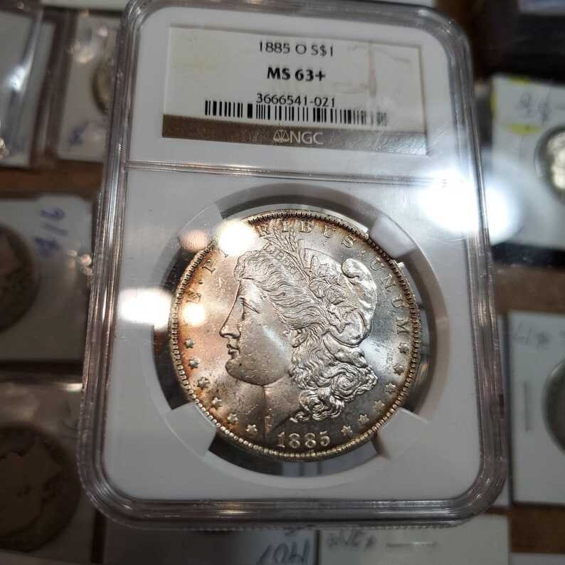 1885 O Morgan Silver Dollar, Nicely  Toned. NGC MS63+ lot#229