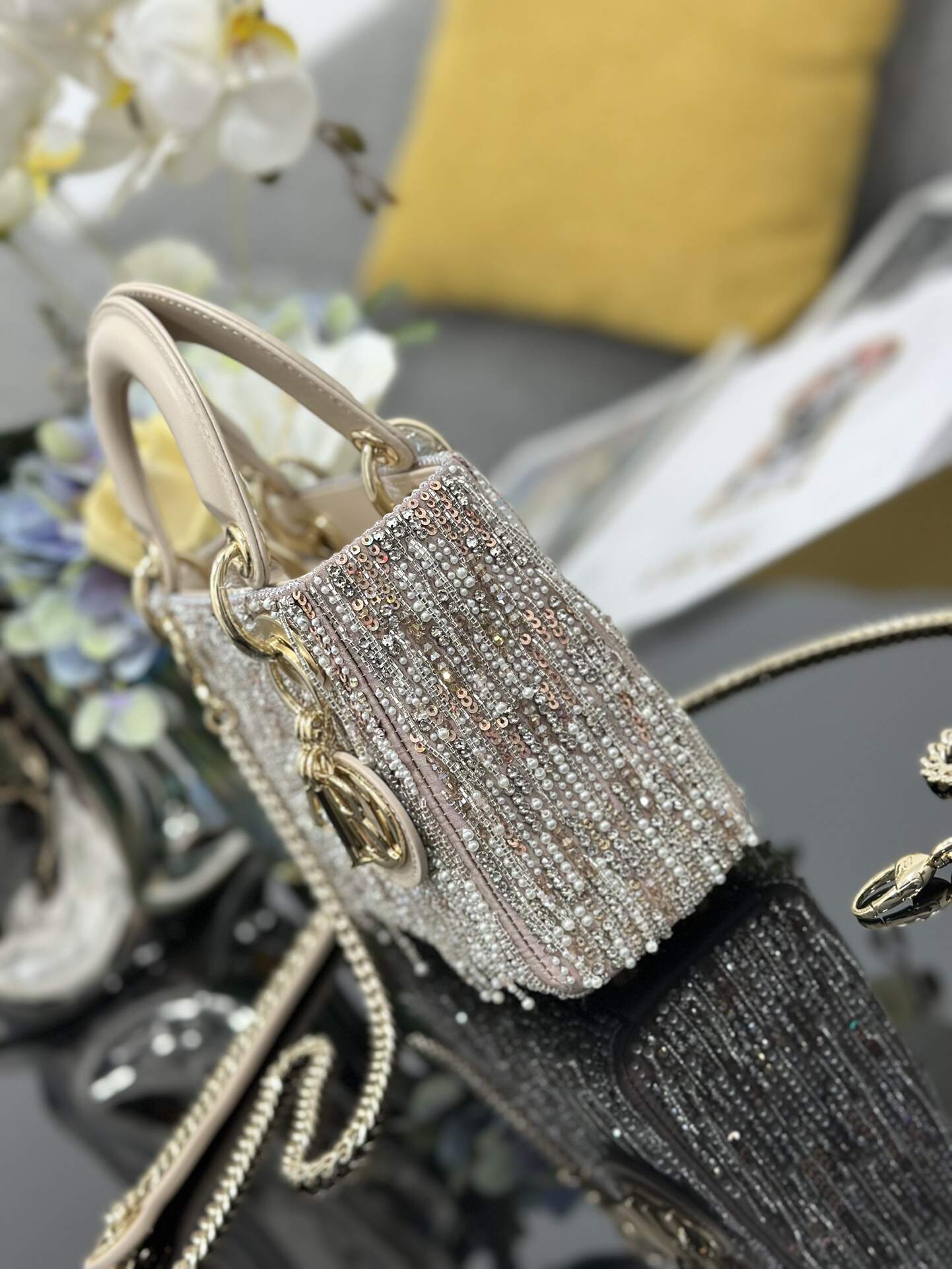 The Lady Dior Three-Grid Embroidered Fringe Beaded bag features an interior lined with lambskin