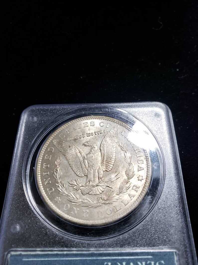 1904 O  Morgan Silver Dollar PCGS MS62, Old Green Rattler.   Lot # 1490 Regular 115