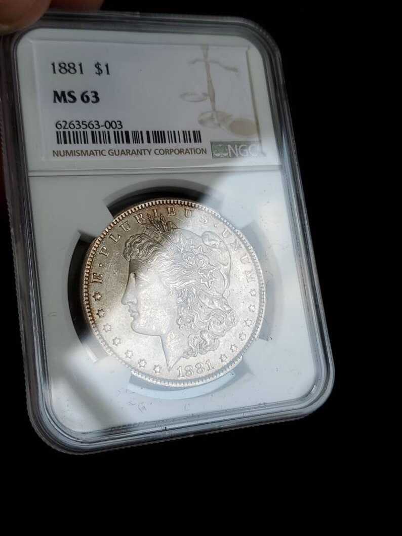 1881  MS 63 Silver Morgan Dollar, NGC  MS 63  Silver  Coin . Beautiful Toning ! Key date!   Lot # 1479