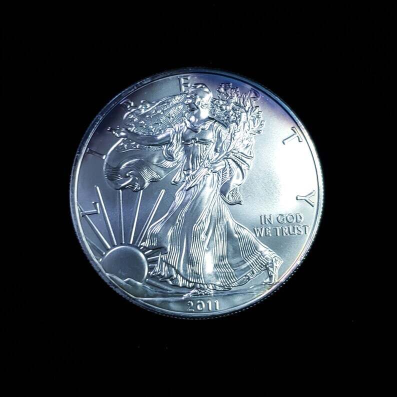 2011   American Silver Eagle BU  -  1 Oz .999 Cool toning on the rim-     Lot# 1210   Key date