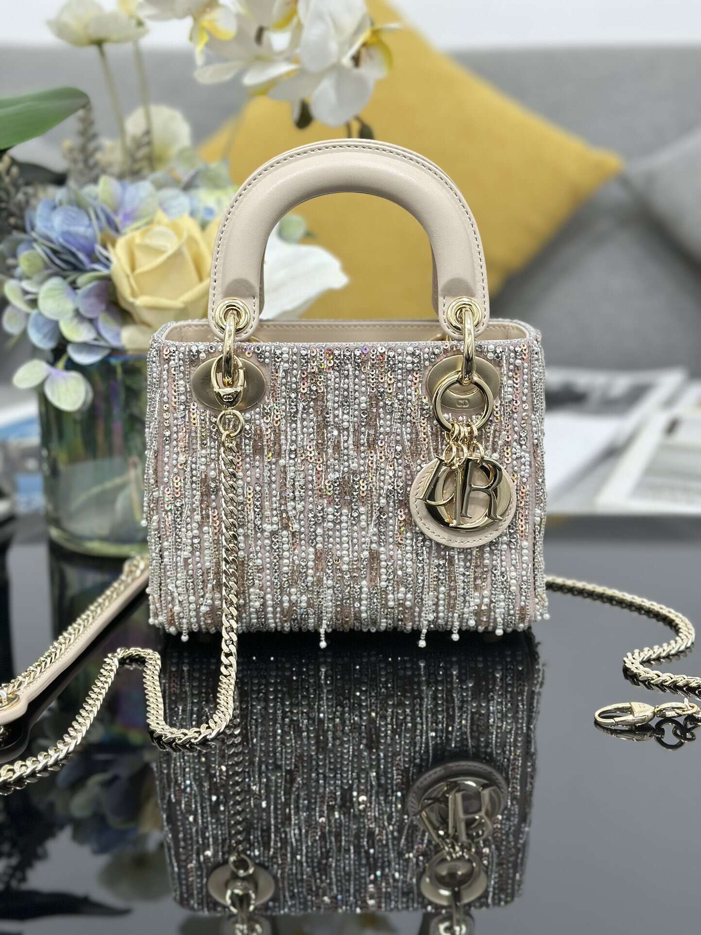 The Lady Dior Three-Grid Embroidered Fringe Beaded bag features an interior lined with lambskin