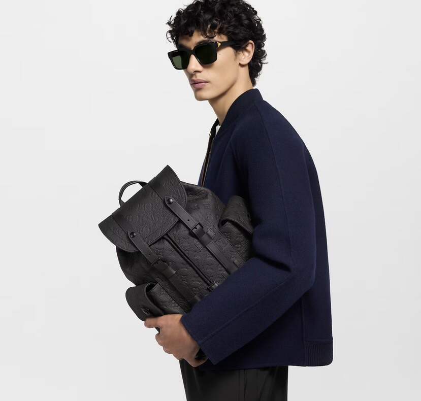 Heritage-Inspired Emblem-Print Leather Backpack – Compact Design with Side Pockets & Padded Tablet Compartment