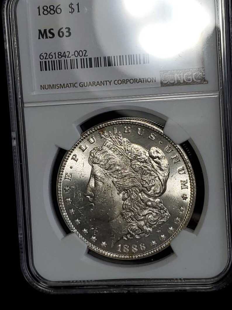 1886  MS 63 Silver Morgan Dollar, NGC  MS 63  Silver  Coin . Blast White!   Lot # 1491