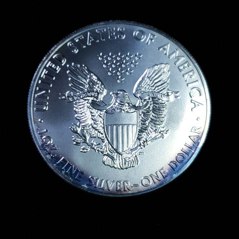 2011   American Silver Eagle BU  -  1 Oz .999 Cool toning on the rim-     Lot# 1210   Key date