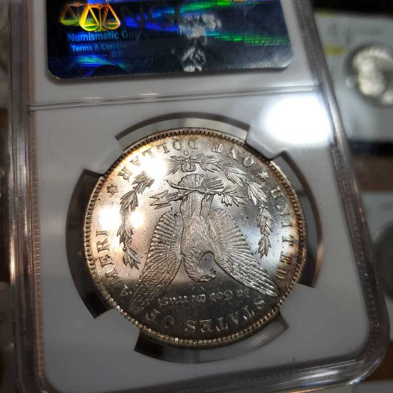 1885 O Morgan Silver Dollar, Nicely  Toned. NGC MS63+ lot#229
