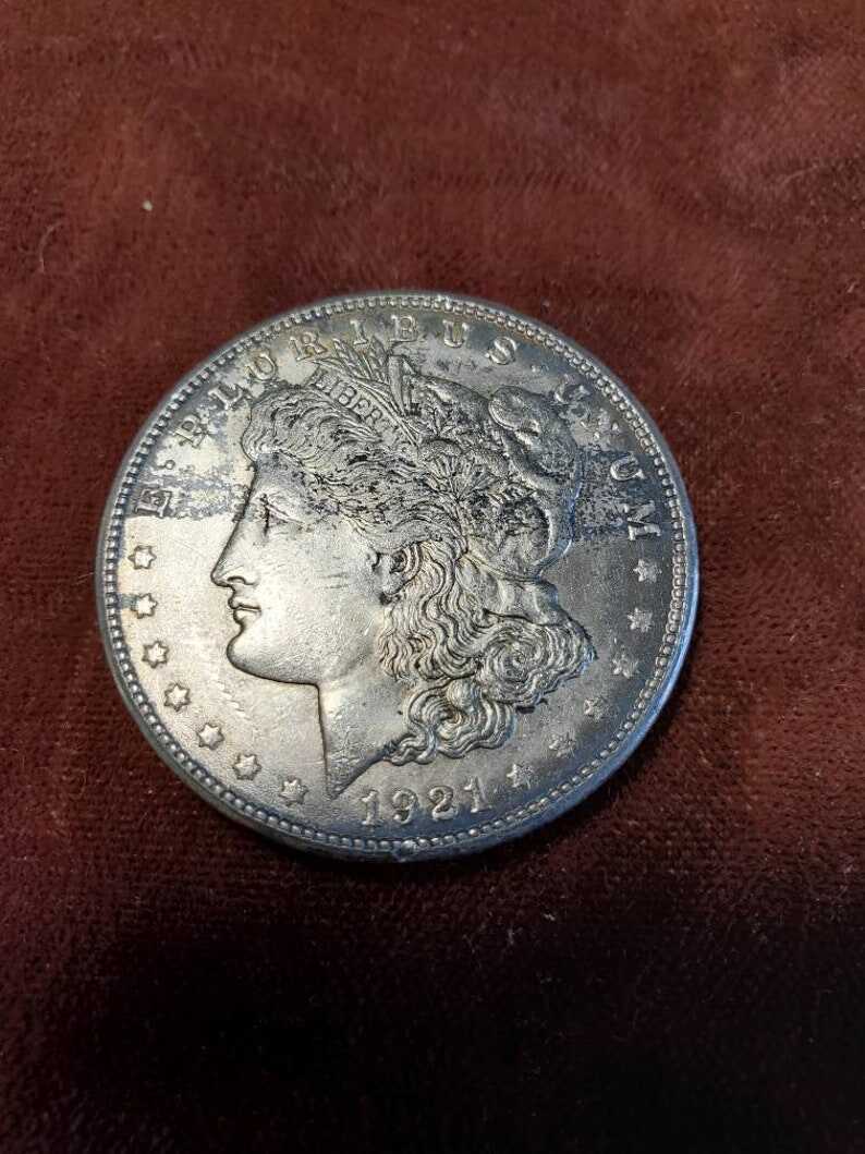 1921 S Silver Morgan Dollar AU black toning on front/ reverse corners  Lot#502