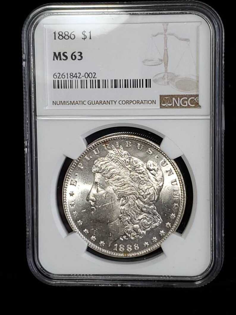 1886  MS 63 Silver Morgan Dollar, NGC  MS 63  Silver  Coin . Blast White!   Lot # 1491