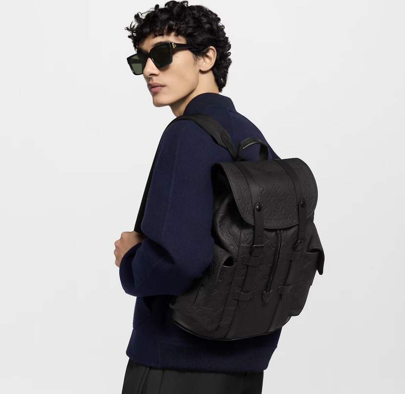 Heritage-Inspired Emblem-Print Leather Backpack – Compact Design with Side Pockets & Padded Tablet Compartment