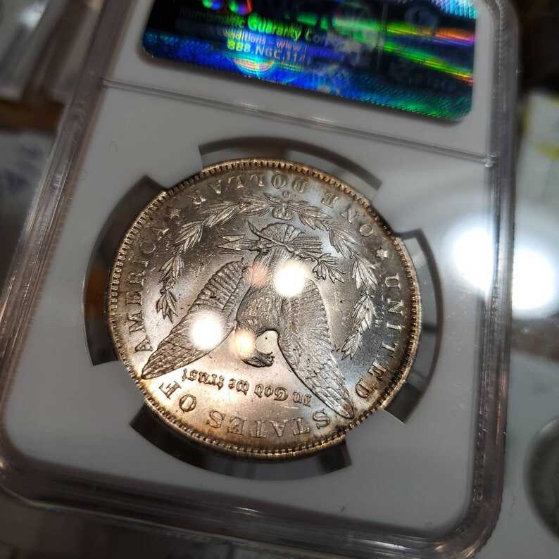 1885 O Morgan Silver Dollar, Nicely  Toned. NGC MS63+ lot#229