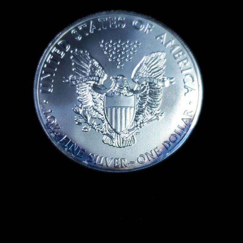 2011   American Silver Eagle BU  -  1 Oz .999 Cool toning on the rim-     Lot# 1210   Key date