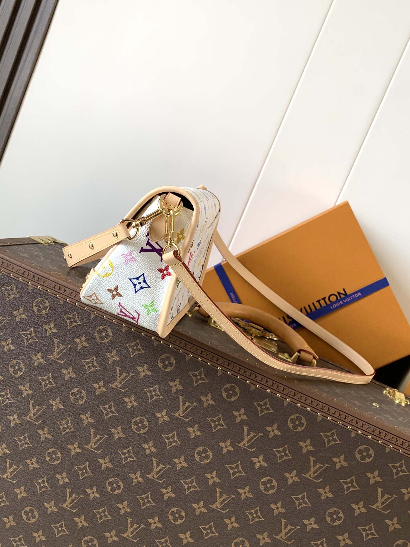 Louis Vuitton's classic Monogra This colorful Diane PM handbag with chips