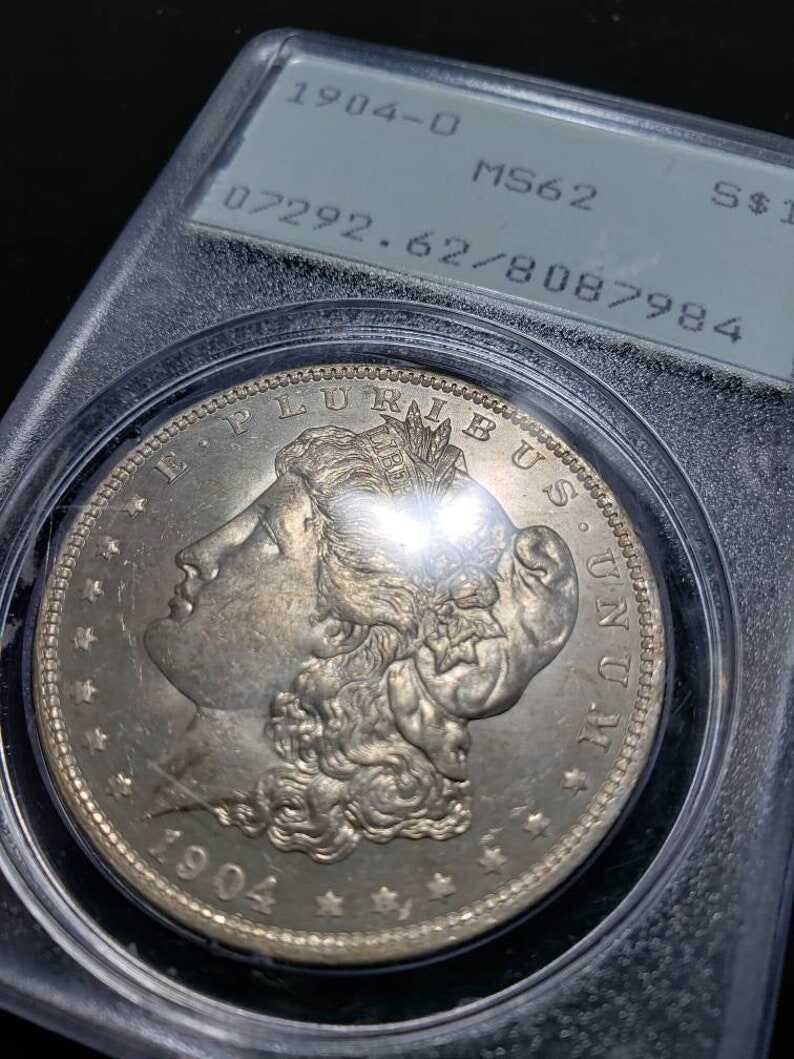 1904 O  Morgan Silver Dollar PCGS MS62, Old Green Rattler.   Lot # 1490 Regular 115