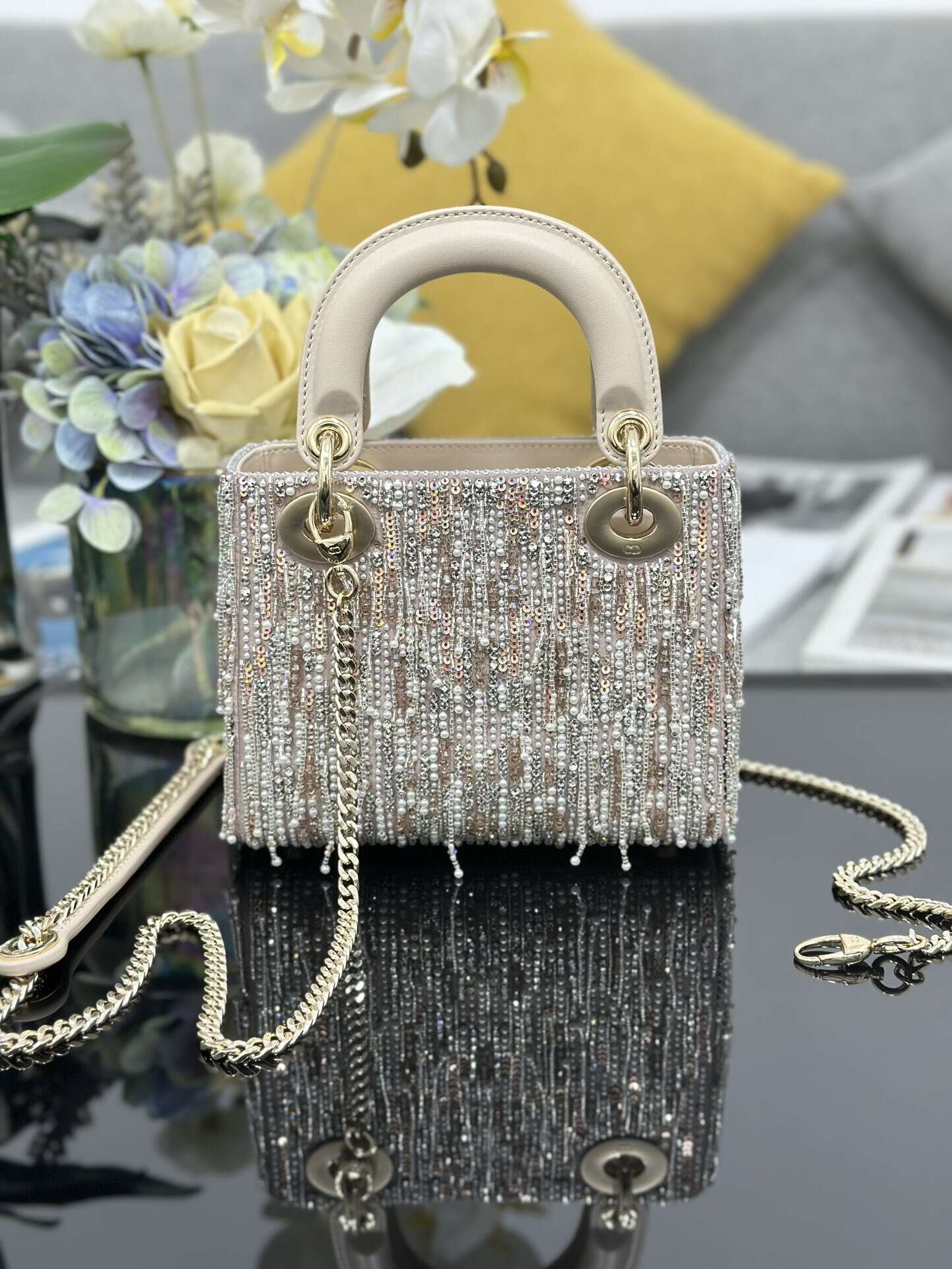 The Lady Dior Three-Grid Embroidered Fringe Beaded bag features an interior lined with lambskin