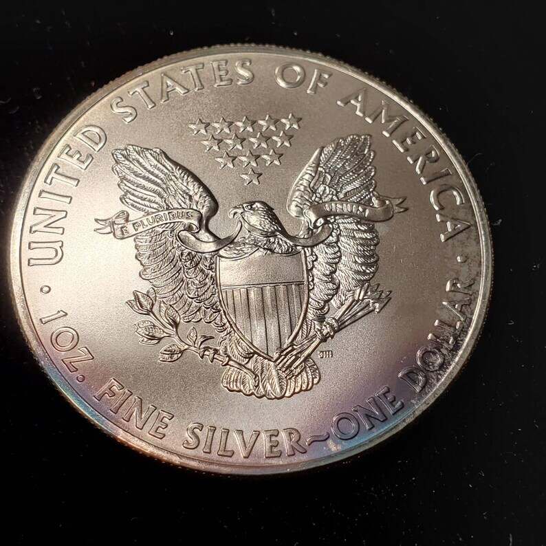 2011   American Silver Eagle BU  -  1 Oz .999 Cool toning on the rim-     Lot# 899 Key date