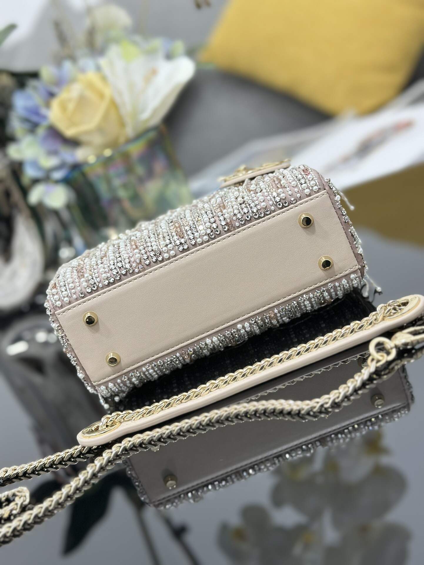 The Lady Dior Three-Grid Embroidered Fringe Beaded bag features an interior lined with lambskin