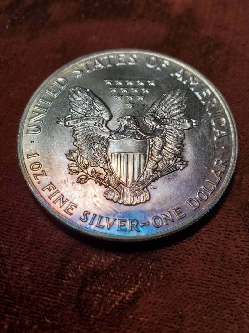 1987 American Silver Eagle BU  -  1 Oz .999 - Nice toning - Includes airtight capsule-  Lot# 475