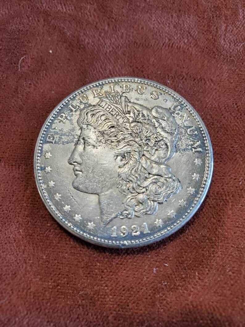 1921 S Silver Morgan Dollar AU black toning on front/ reverse corners  Lot#502
