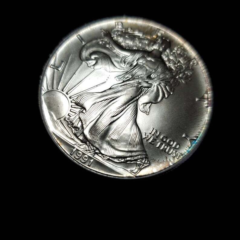 1991  American Silver Eagle BU  -  1 Oz .999 Cool toning on the rim-     Lot# 816