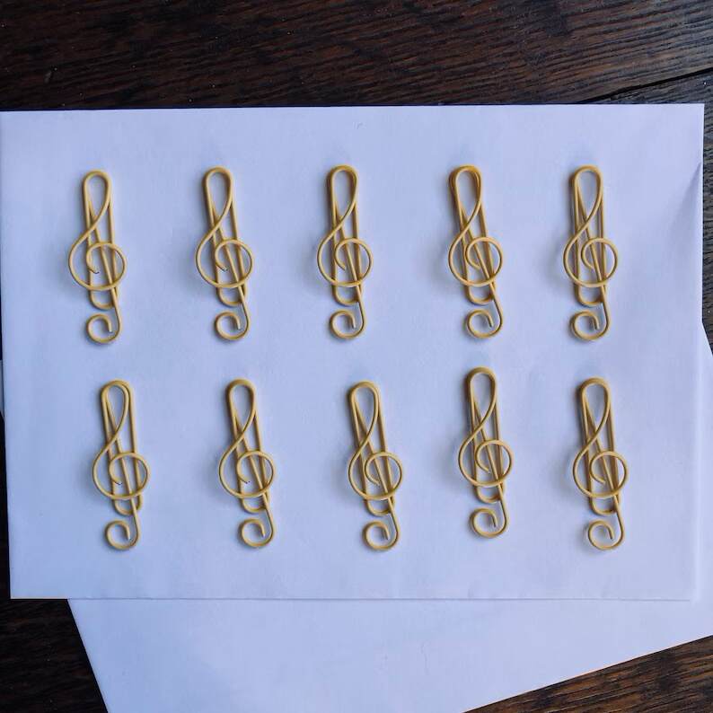 A set of 10 high quality music treble clef colored metal paper clips