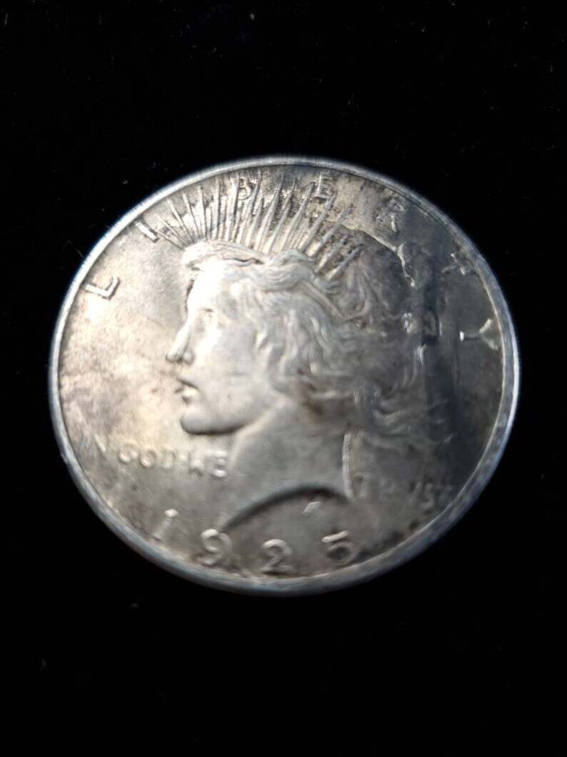 1925  Silver Peace Dollar AU - tarnish on obverse/reverse   Lot# 129