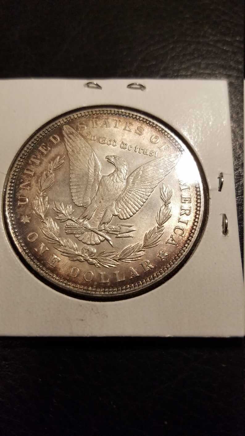 1887 Morgan Silver Dollar BU - nice toning! . Lot#599 Regular 105