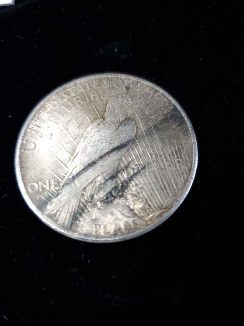 1925  Silver Peace Dollar AU - tarnish on obverse/reverse   Lot# 129