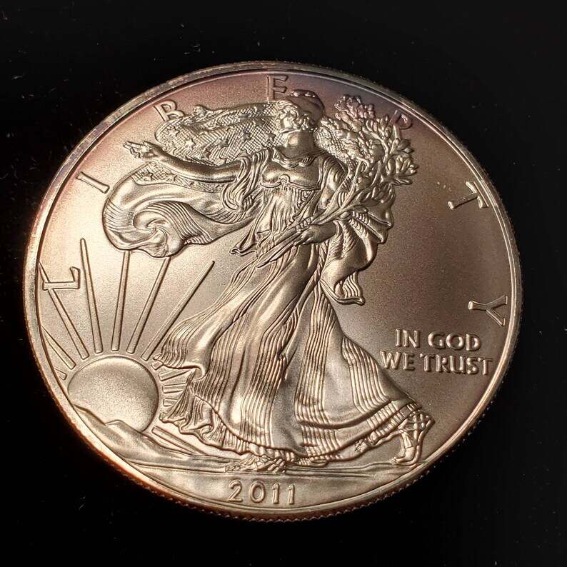 2011   American Silver Eagle BU  -  1 Oz .999 Cool toning on the rim-     Lot# 899 Key date