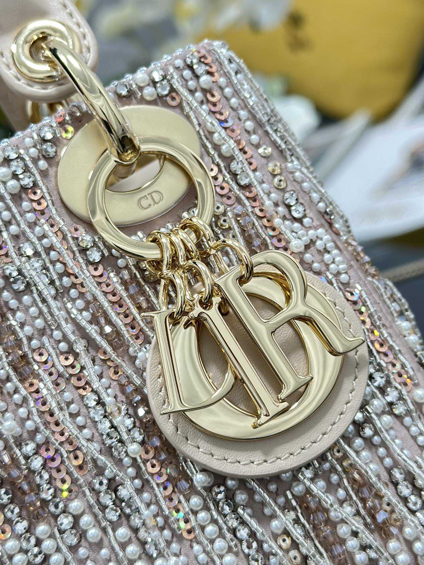 The Lady Dior Three-Grid Embroidered Fringe Beaded bag features an interior lined with lambskin