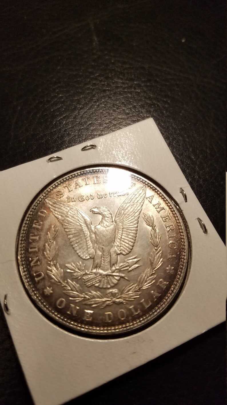 1887 Morgan Silver Dollar BU - nice toning! . Lot#599 Regular 105